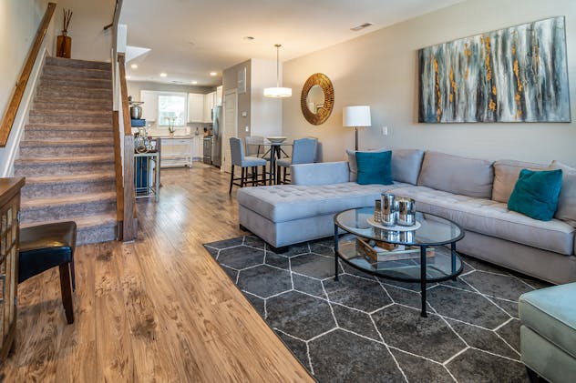 a living room with grey and blue decor